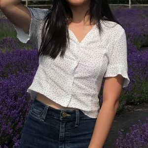 polka dot blouse with ruffled sleeves